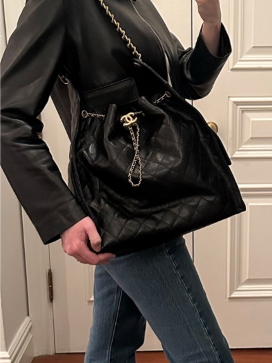 CHANEL Handbags - Black Quilted Medium 25 Leather Drawstring Tote with Gold CC Chain